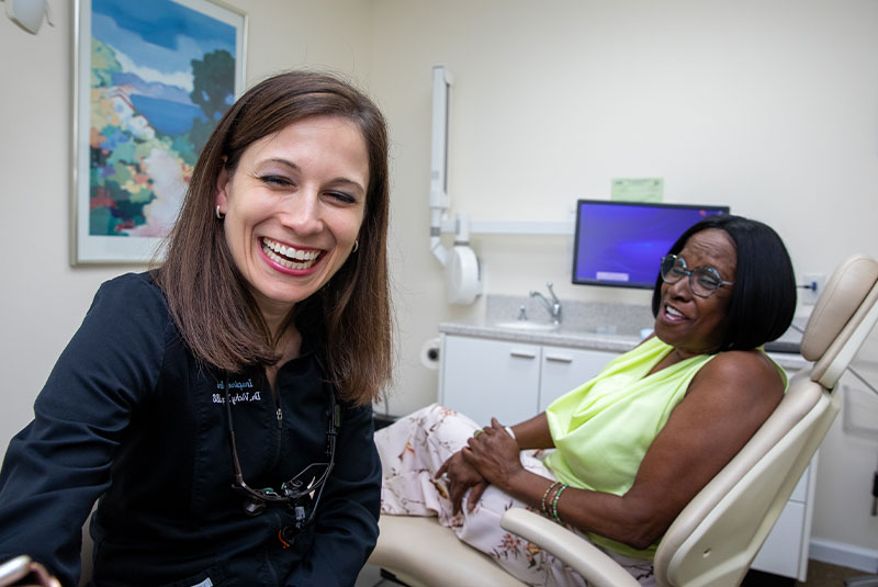 dr. vicky yeager smiling with patient