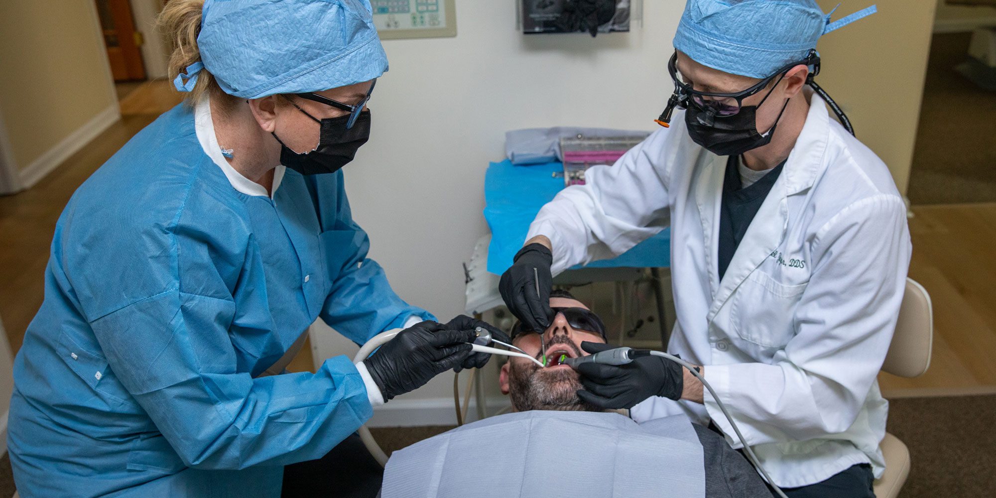 dentist performing surgical procedure